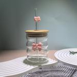 Elegant glass cup with lid and straw